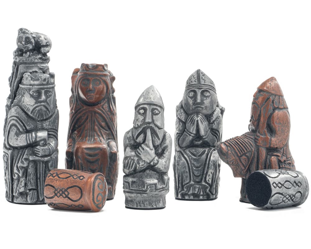 Medieval metallic chess pieces handcrafted in the UK, featuring detailed resin designs inspired by historical chessmen.