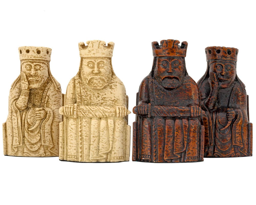 Isle Of Lewis Chessmen pieces from National Museums Scotland, featuring finely inlaid designs in beige and dark brown.