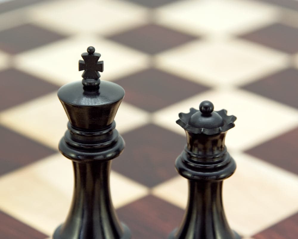 Sentinel Series Ebony and Boxwood Staunton Chess King and Queen Pieces on Chessboard