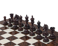 The Garvi 4 inch Rosewood Chessmen set on a 21 inch chessboard, featuring intricately carved 16th century Indian inspired pieces.