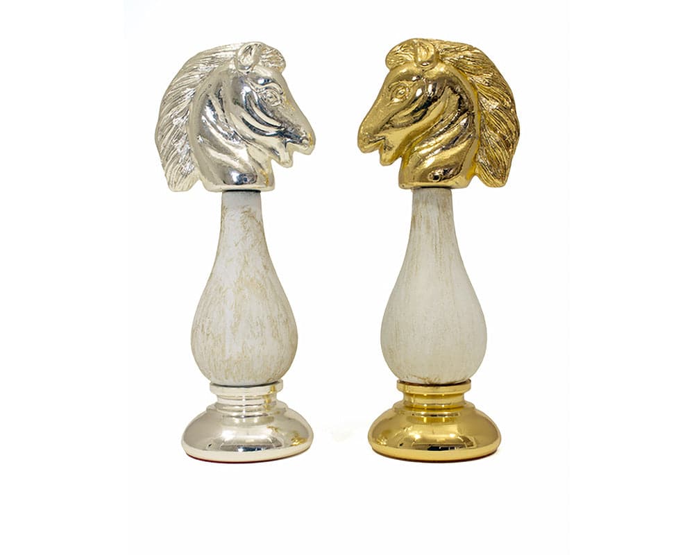 San Severeo 24 carat gold and 990 silver plated chess knights crafted in Italy with solid oak bases.