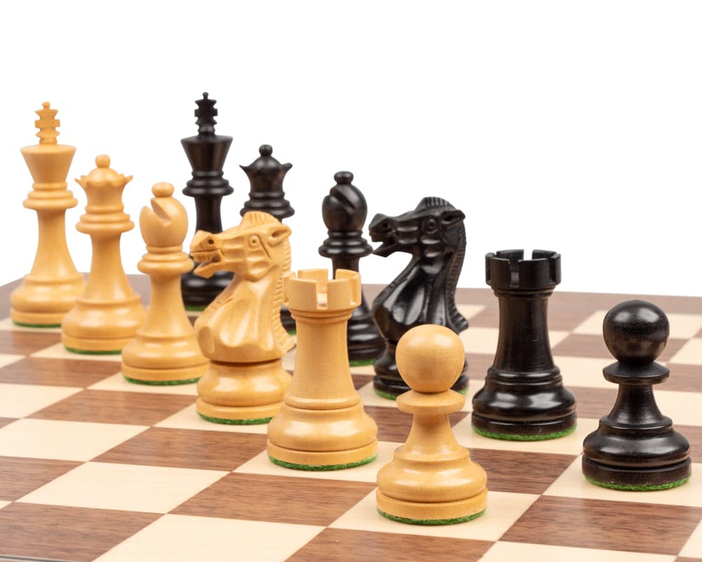 Executive Staunton Ebonised Chess Men set on a chessboard, featuring beautifully carved and detailed boxwood pieces, including a 3-inch king.