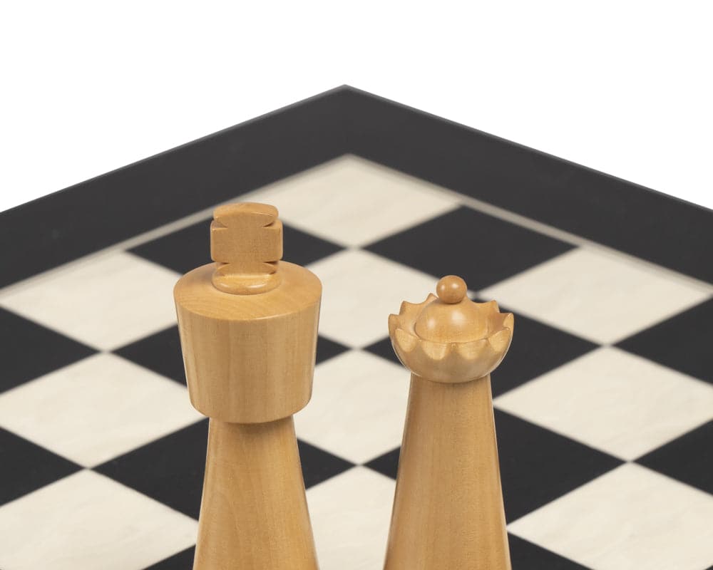 Art Deco ebonised and boxwood 3.5 inch king and queen chess pieces on chessboard