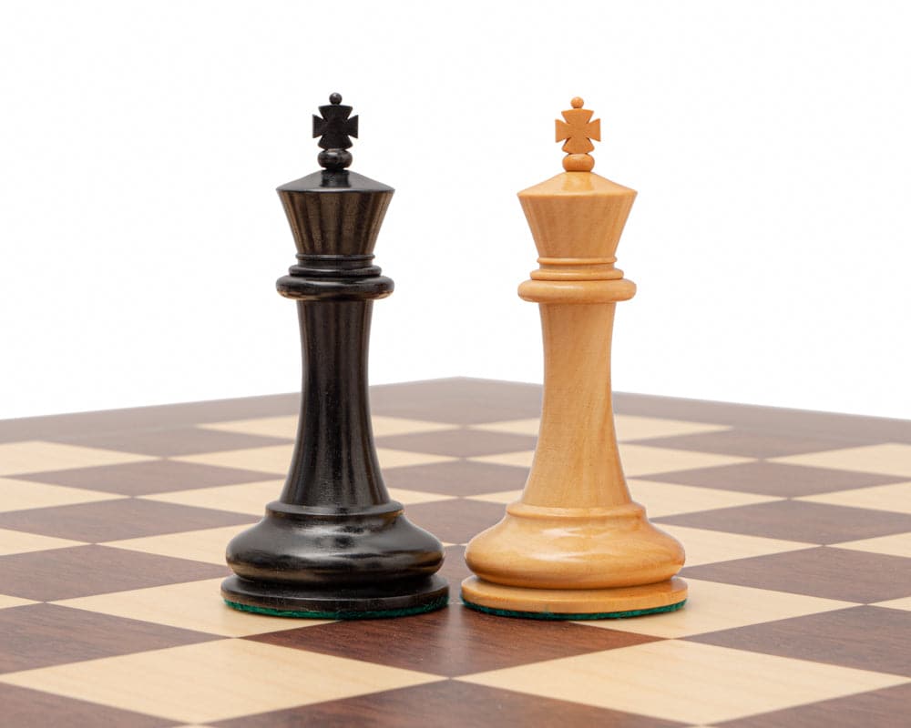 Ebony and boxwood 3.5 inch king chess pieces from The 1853 Paulsen Reproduction set on a chessboard at 21 inches