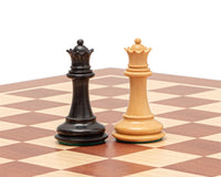 Black and white Warwick Series 3 inch ebonised Staunton chess kings on a chessboard.