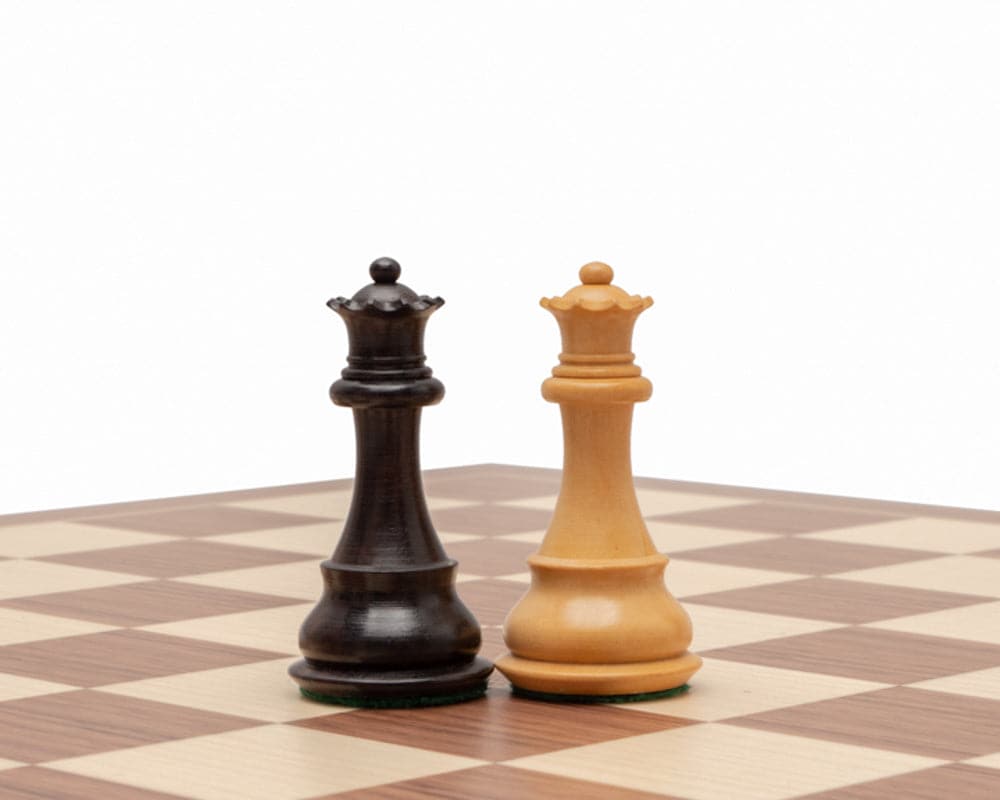 Rosewood and boxwood Staunton chess queens on chessboard, classic 3.5-inch design, superbly crafted and weighted for quality play.