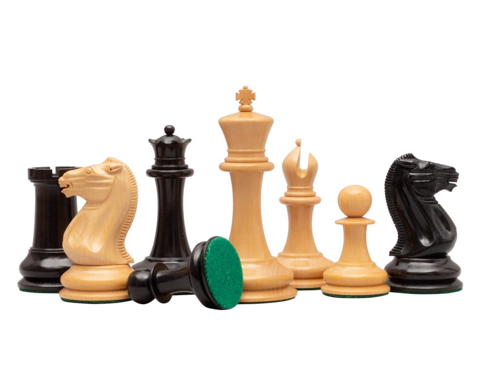 Classic Staunton rosewood chess pieces with a 4.25 inch king and billiard cloth bases on an Italian walnut board