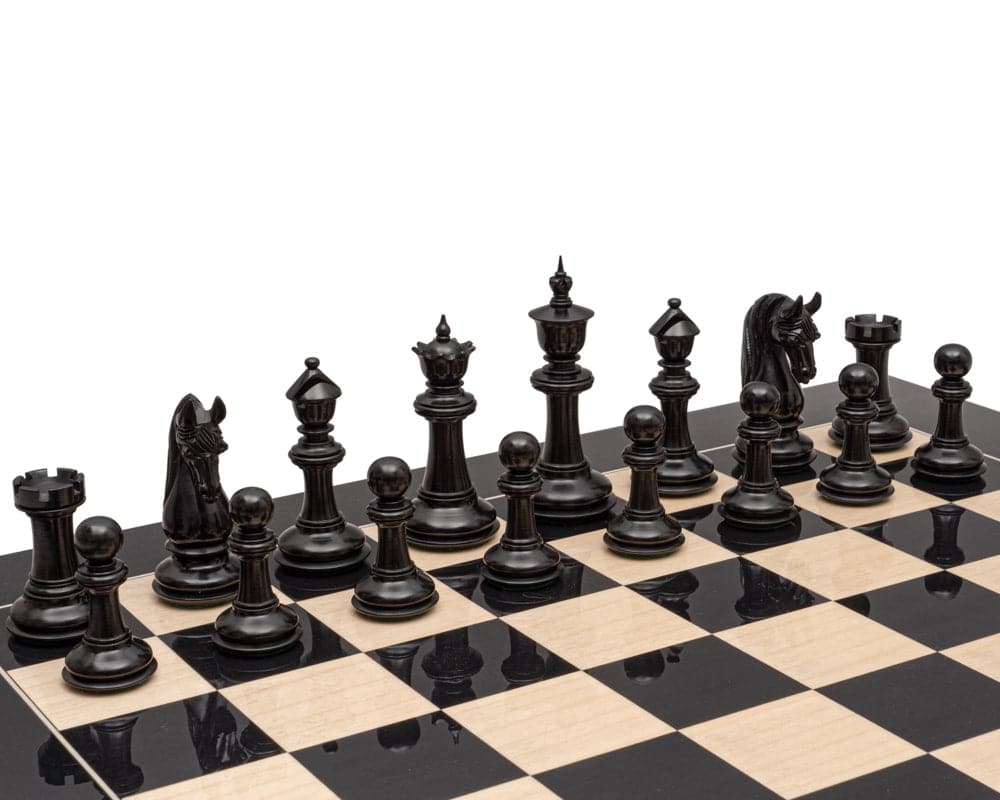 Blackburne Luxury Ebony Chess Men 4.5 inch set up on a chess board, showcasing exquisite detailing and handcrafted quality.