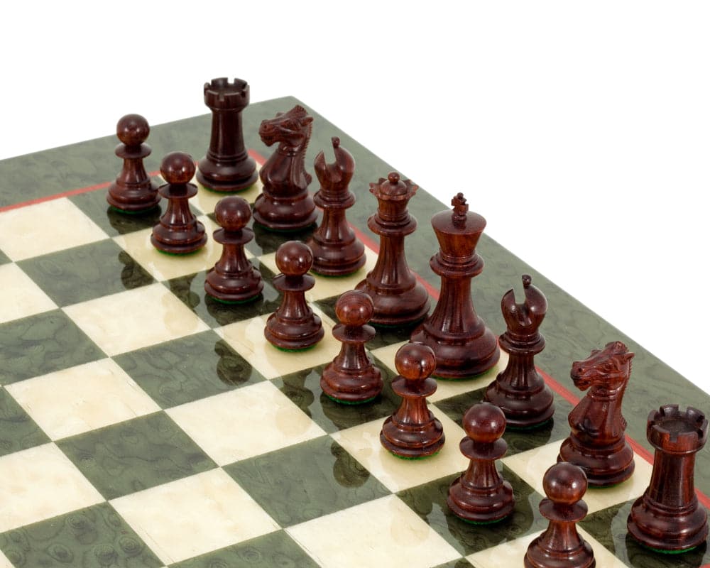 Sandringham Tres Corone Chess Set on Italian chess board made of olive erable burl and maple, featuring red sandalwood pieces.