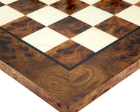 Detailed close-up of a luxurious 24-inch chess board, featuring hand-finished briarwood burl veneer and elegant Italian craftsmanship.