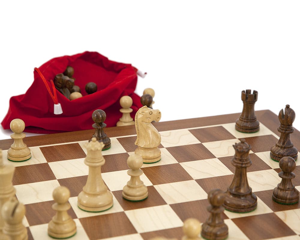 Jacob Knight Sheesham & Mahogany Chess Set with Staunton pieces on mahogany and maple board, red carry bag in background.