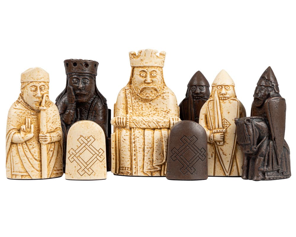 Isle of Lewis chess set pieces in cream and brown, including king, bishop, queen, and knight, on white background