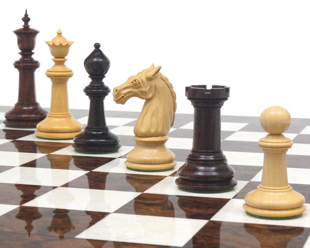 Rosewood and dark walnut Staunton chess pieces on a glossy wooden chessboard