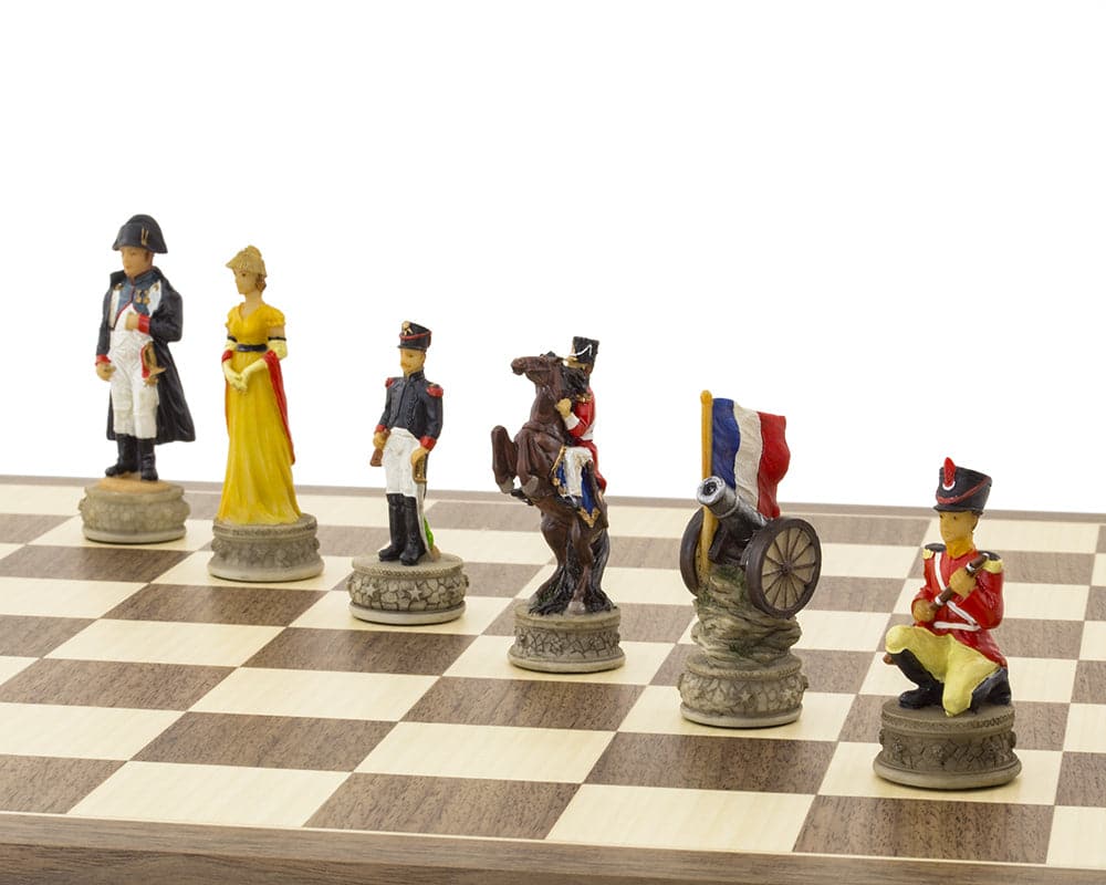 Hand painted Battle of Waterloo-themed chess set pieces featuring Bonaparte, Josephine, and intricately carved cavalry.