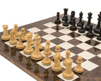 The Monarch Ebony And Walnut Grand Luxury Chess Set on a chess board ready for play