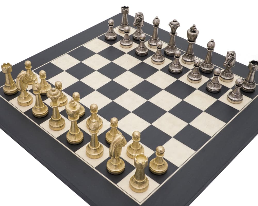 The Finnesburg and Black Classic Ornate Chess Set with detailed gold and silver pieces on a black and white chessboard.