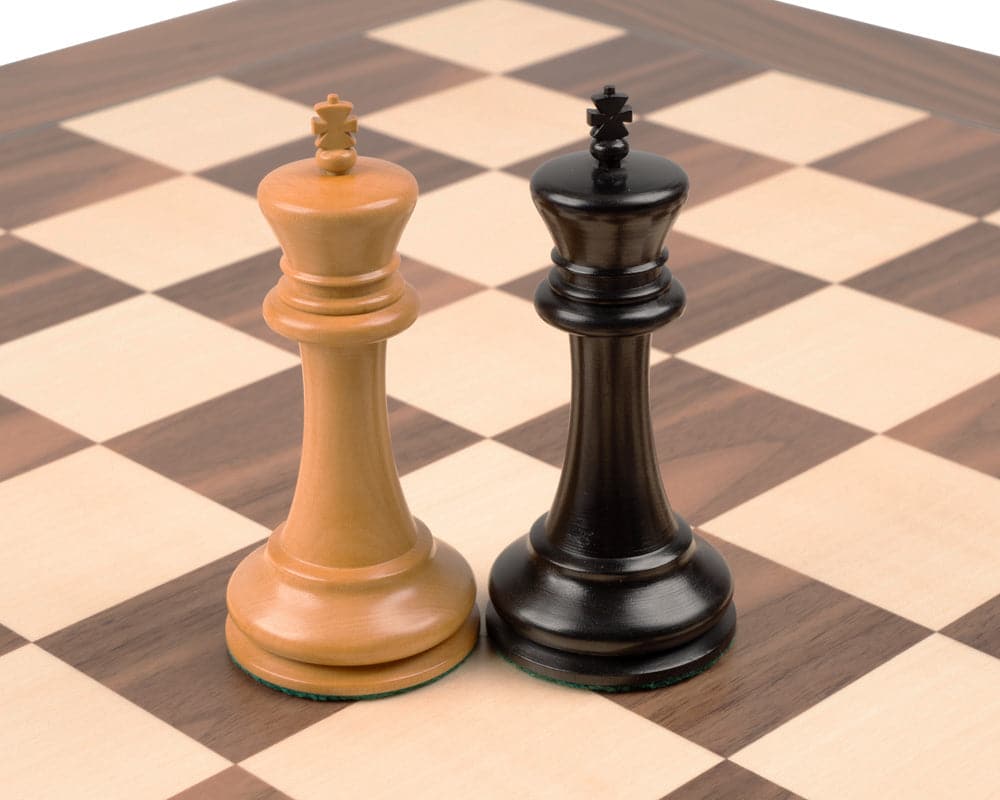 Kings from the 1869 Reproduction Staunton Ebony and Walnut Grand Luxury Chess Set on a deluxe chessboard