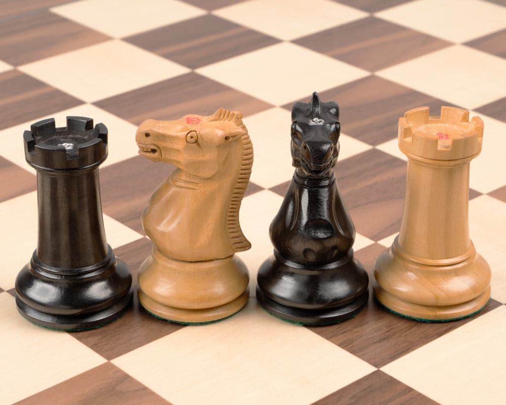 Handcrafted ebony and walnut Staunton chess pieces on luxury chess board