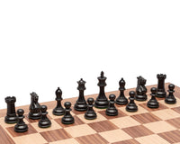 The Highclere Ebony and Walnut Traditional Chess Set with detailed ebony pieces on a walnut and maple board.