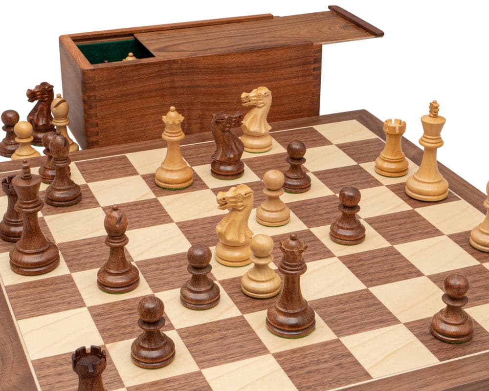 The Executive Sheesham and Maple Staunton Chess Set with hand-turned pieces on a high-grade walnut and maple veneer board.