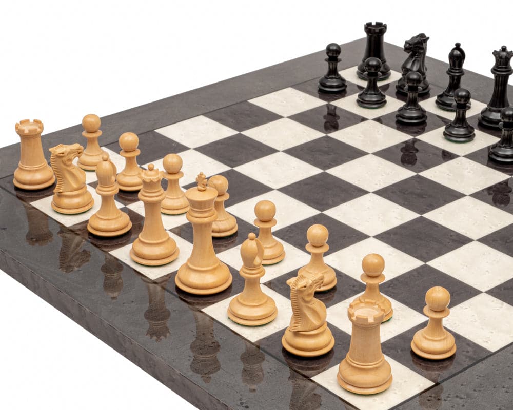 The Sovereign Ebony and Grey Briarwood Luxury Chess Set with Staunton design, 3-inch king, two additional queens, on a 20-inch high gloss Italian board.